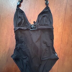 SHAN black One-Piece Swimsuit with Buckle Detail and pebbles around the neck